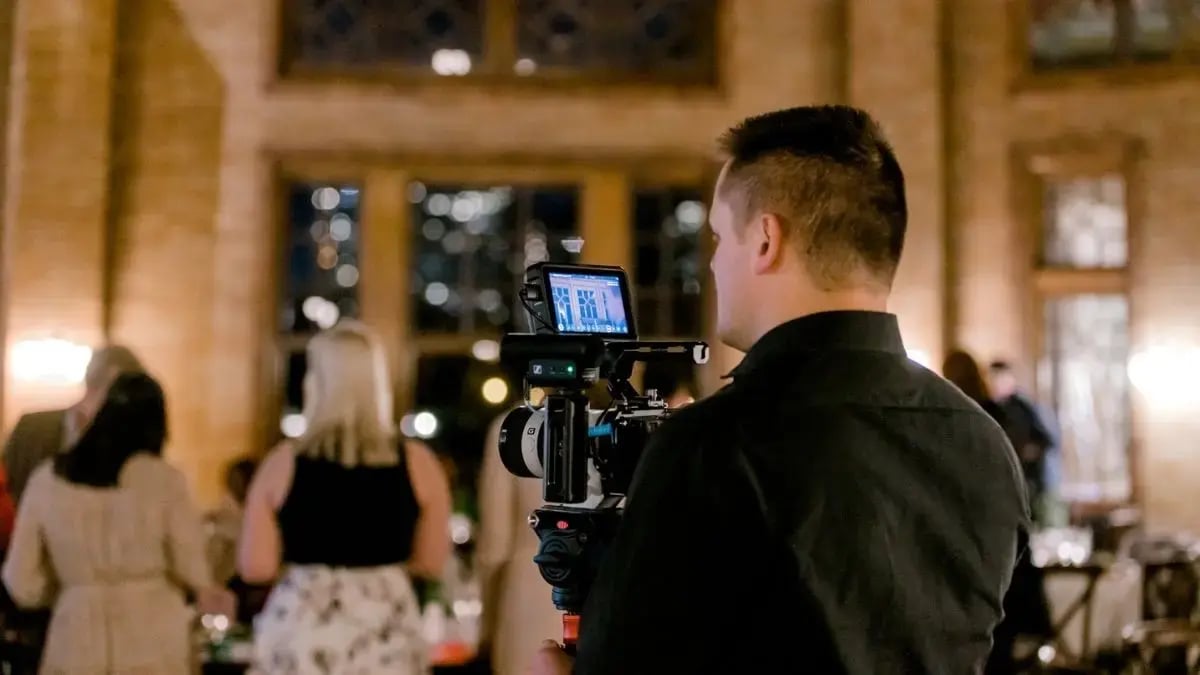 camera operator filming event space