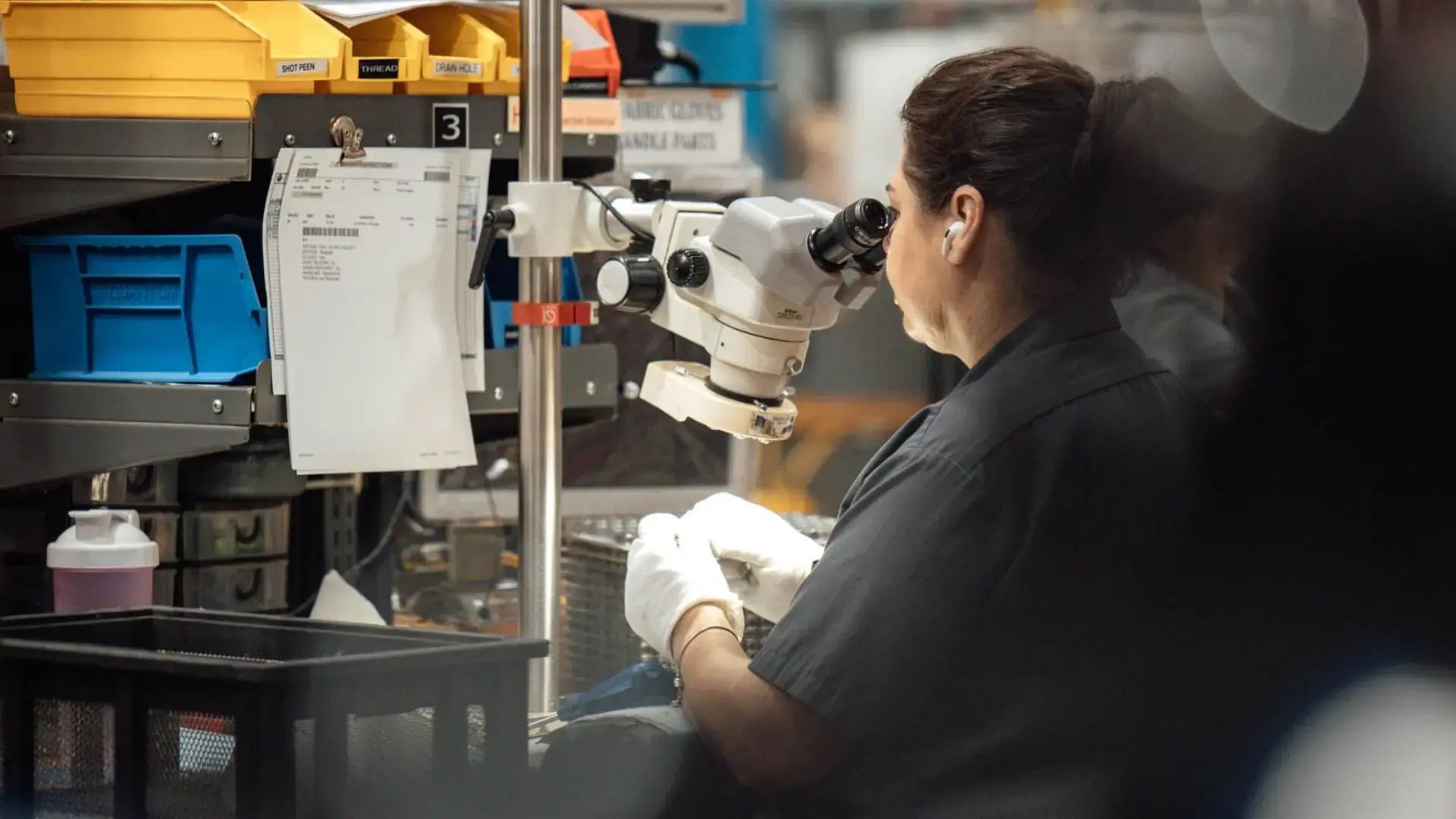 woman viewing microscope